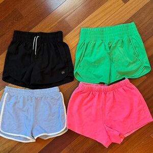 4-Pack Gap shorts. Black XXL kids, green XS women, blue L kids and pink XXL kids